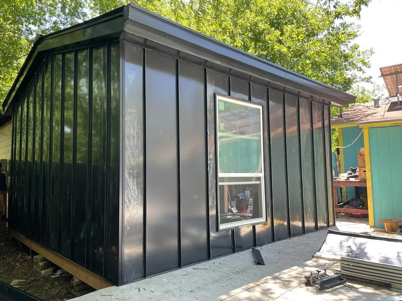 Black standing seam metal wall panels for Metal Roof Installation in Lloyd