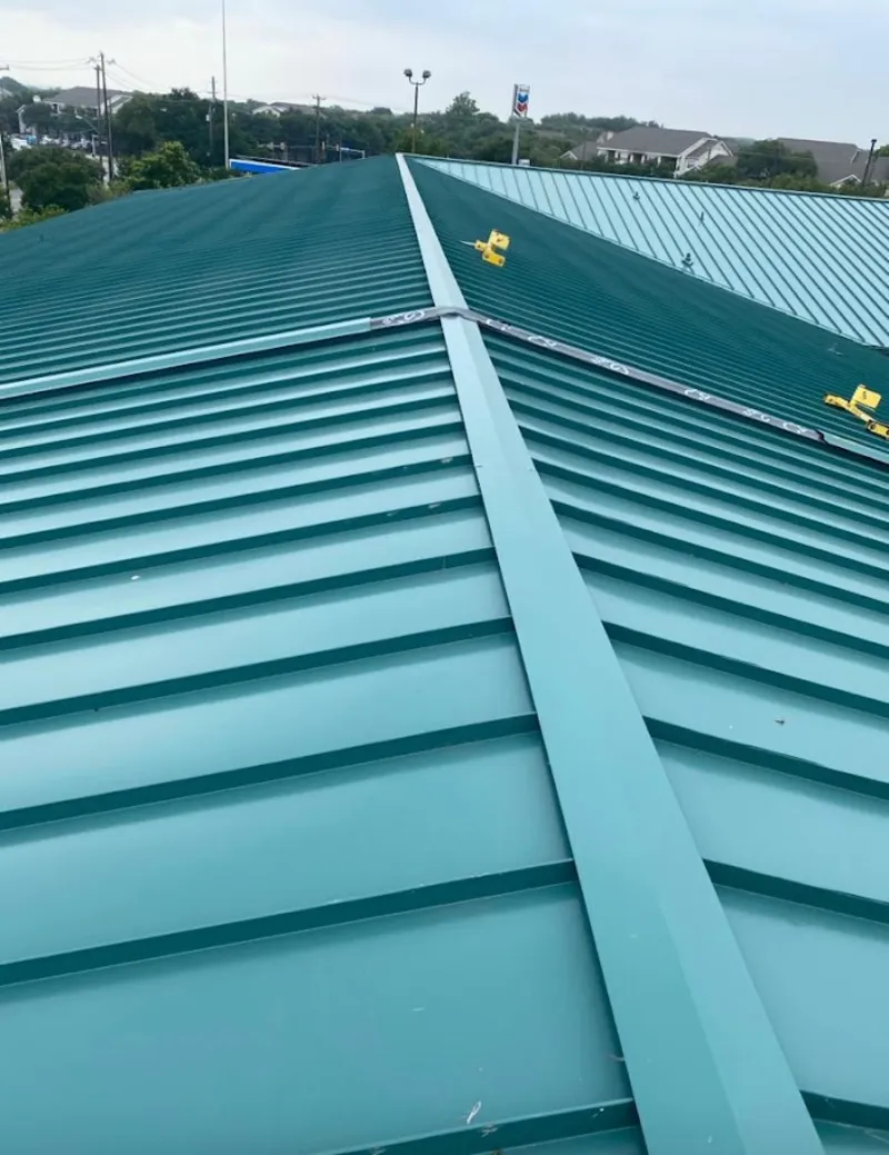 Green commercial metal roof ridge and valley for Metal Roof Repair in Lloyd
